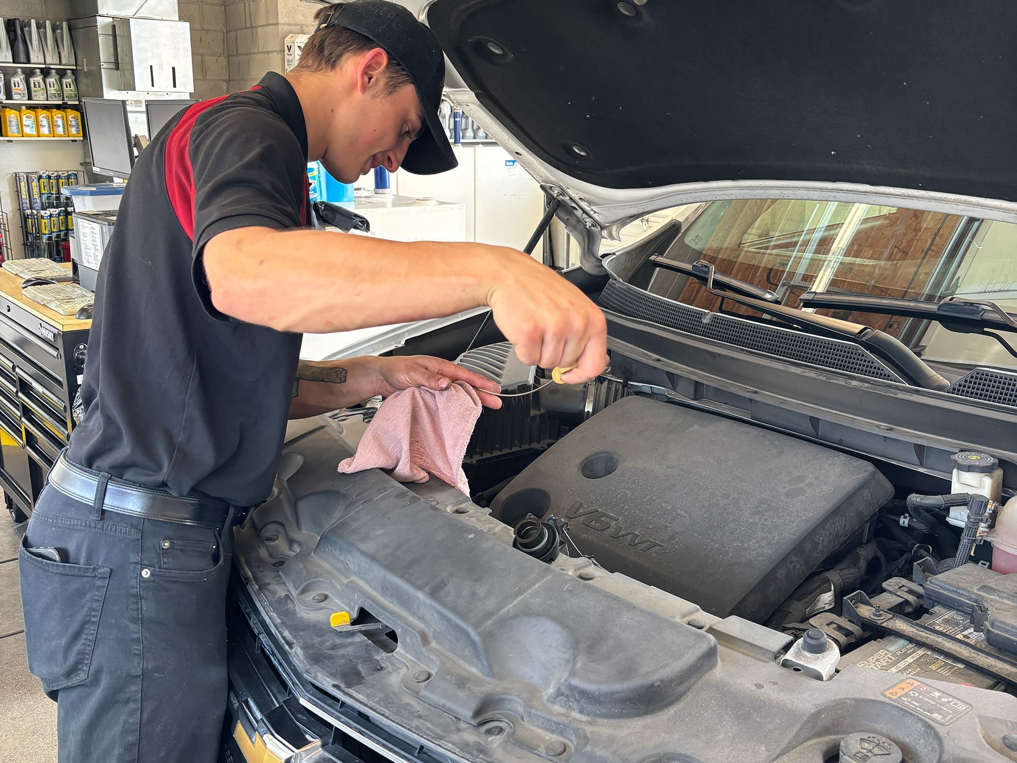 Technician performing oil change in Sparks NV
